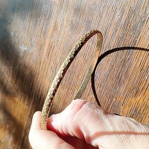 Gold tone bangle bracelet